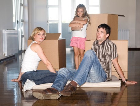Local movers handling boxes in a Marylebone flat